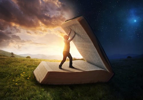 Christian living: A man opens up the pages of the Bible